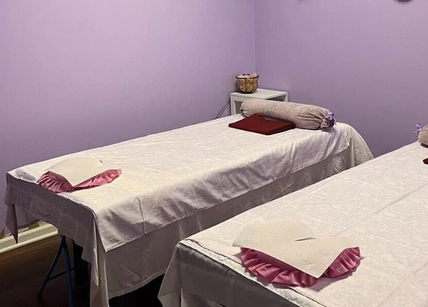 Relaxing massage room at AA Foot & Body Spa in Lisle, Illinois, US, featuring twin massage tables.