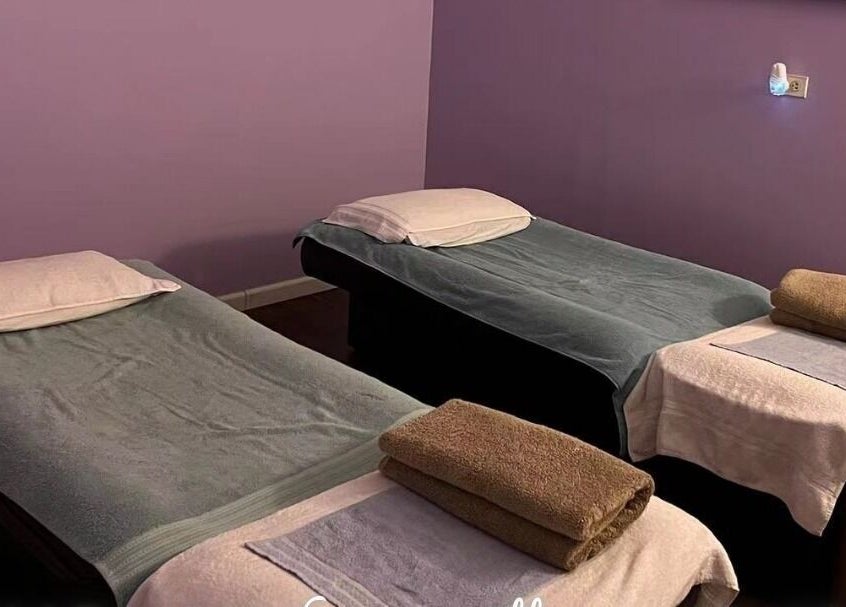 Twin spa beds in a tranquil room at AA Foot & Body Spa, Lisle, Illinois, US, ready for relaxation treatments.