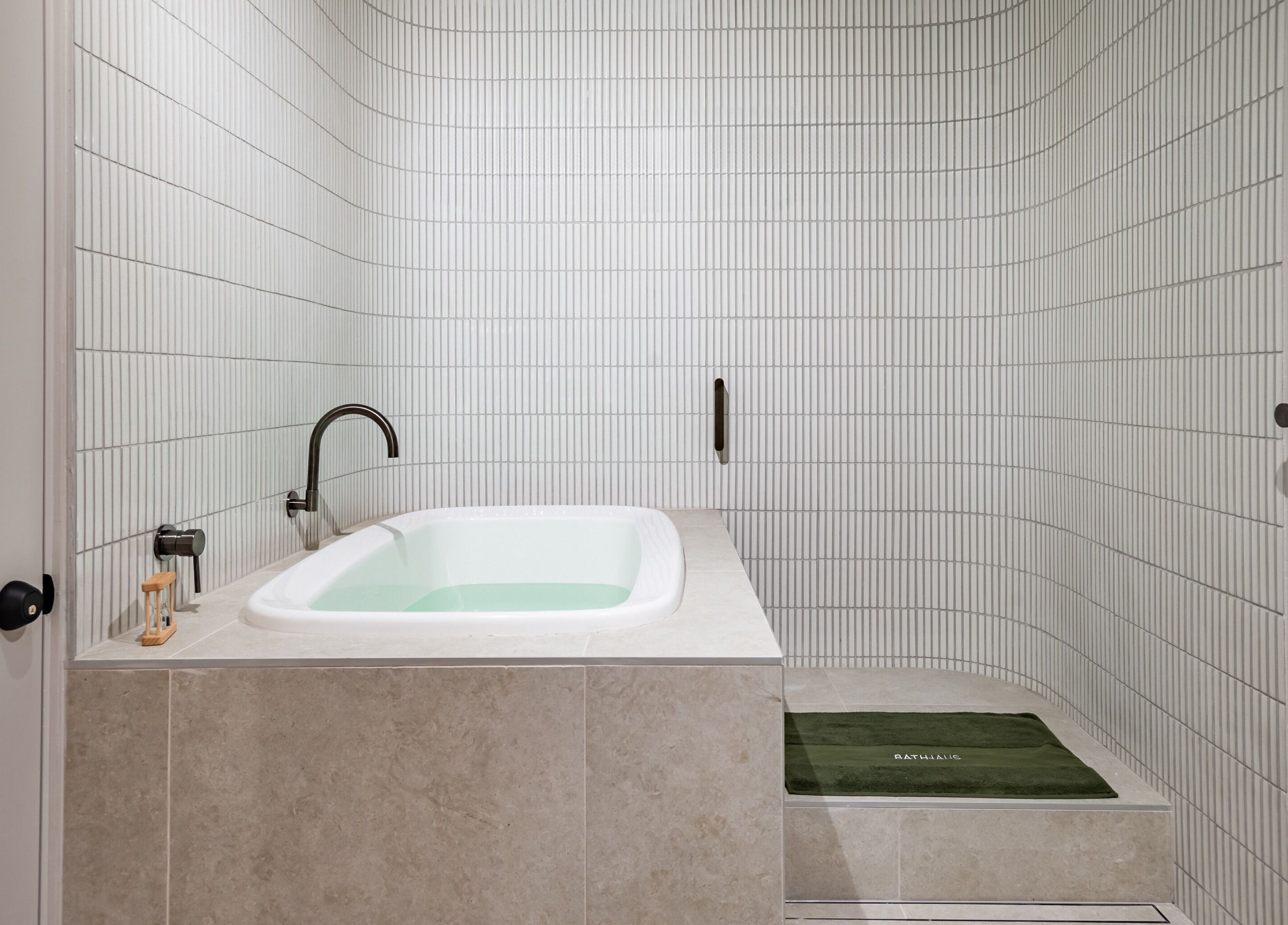 Luxurious spa bath in Bath Haus Cronulla, Cronulla, New South Wales, AU. Elegant design with soothing ambiance.