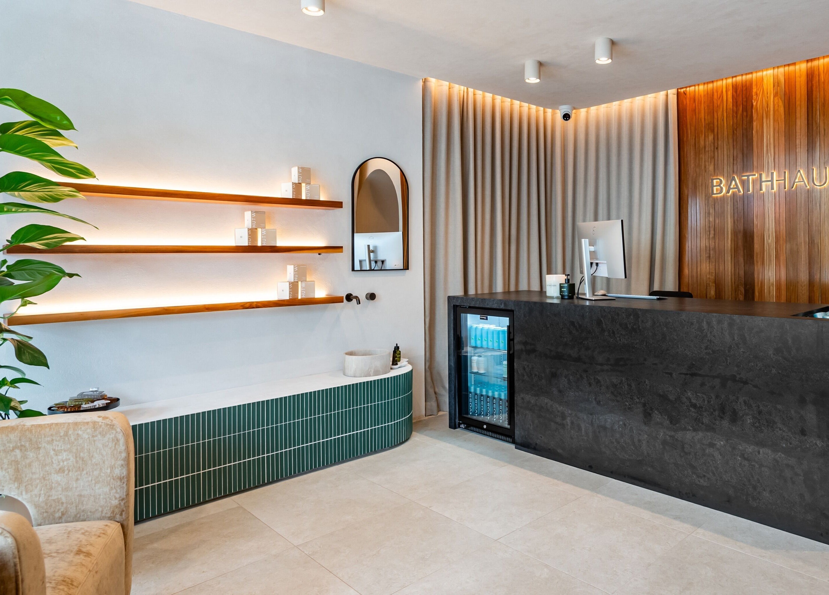 Modern reception area of Bath Haus Cronulla in Cronulla, New South Wales, AU with sleek design and lush plants.