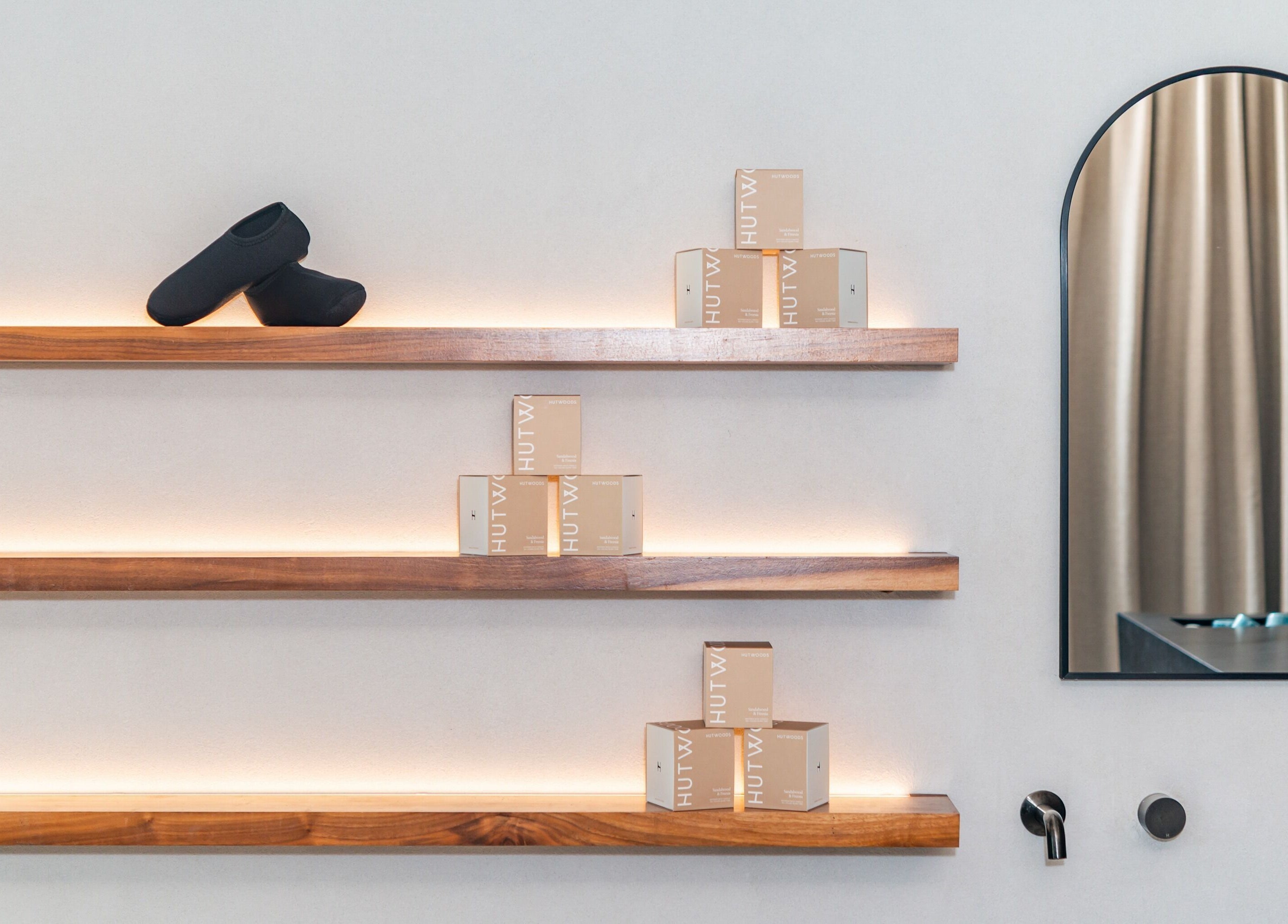 Elegant wooden shelves displaying products at Bath Haus Cronulla, Cronulla, New South Wales, AU.
