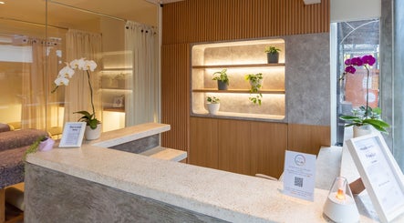 Calming reception at Muscle Works, Bali, Bali, ID, featuring elegant orchids and subtle lighting.