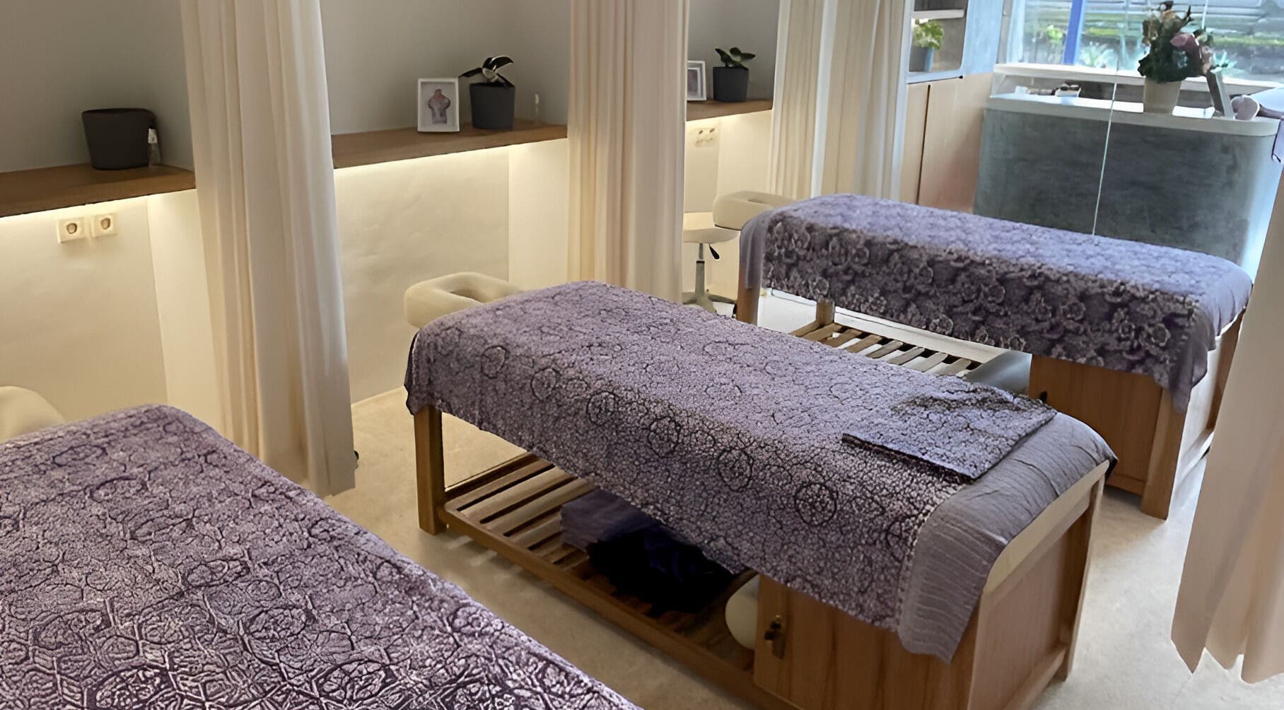 Serene massage room at Muscle Works, Bali, Bali, ID with comfortable tables and soothing decor.