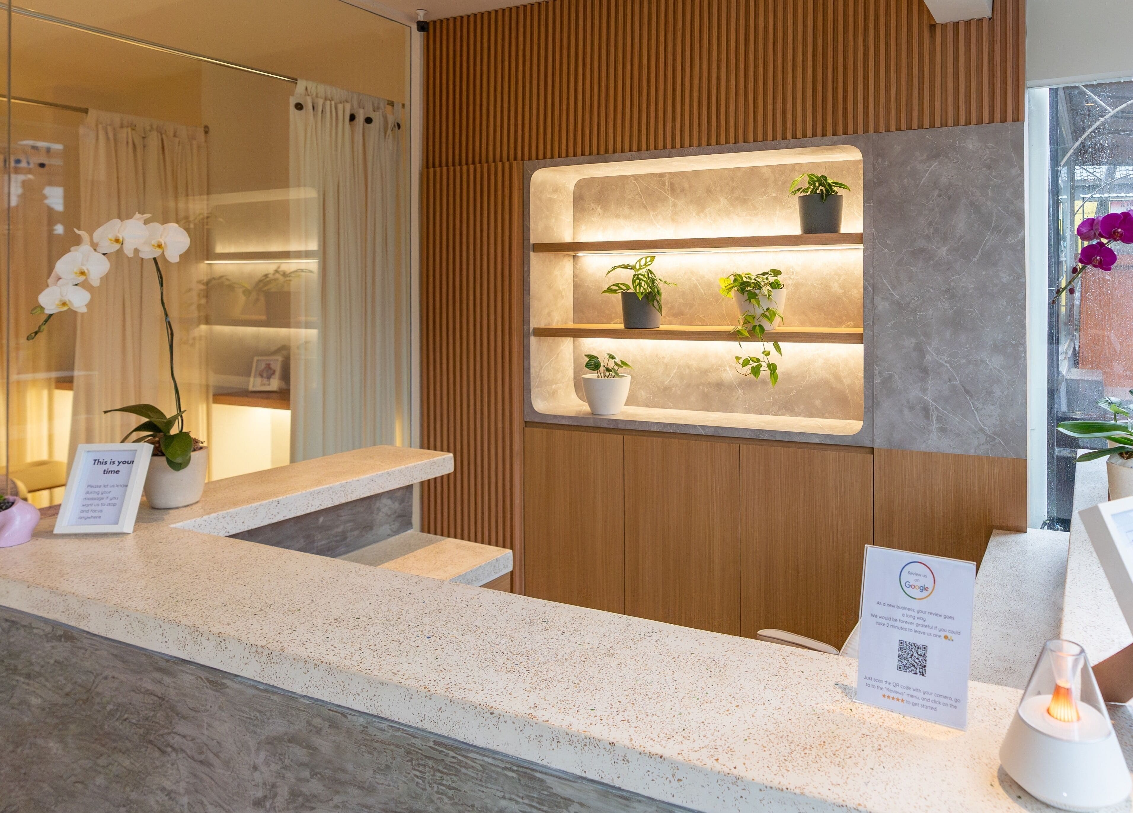 Reception area of Muscle Works, Bali, Bali, ID. Features modern decor and potted plants.