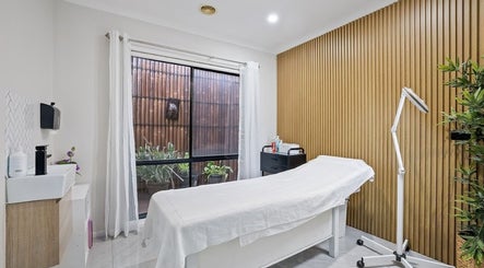 Relaxing spa room at Yasu's Salon, Melbourne, Victoria, AU, featuring a treatment bed and modern decor.