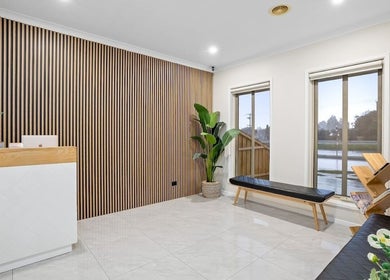 Elegant lobby of Yasu's Salon in Melbourne, Victoria, AU, featuring modern decor and natural light.