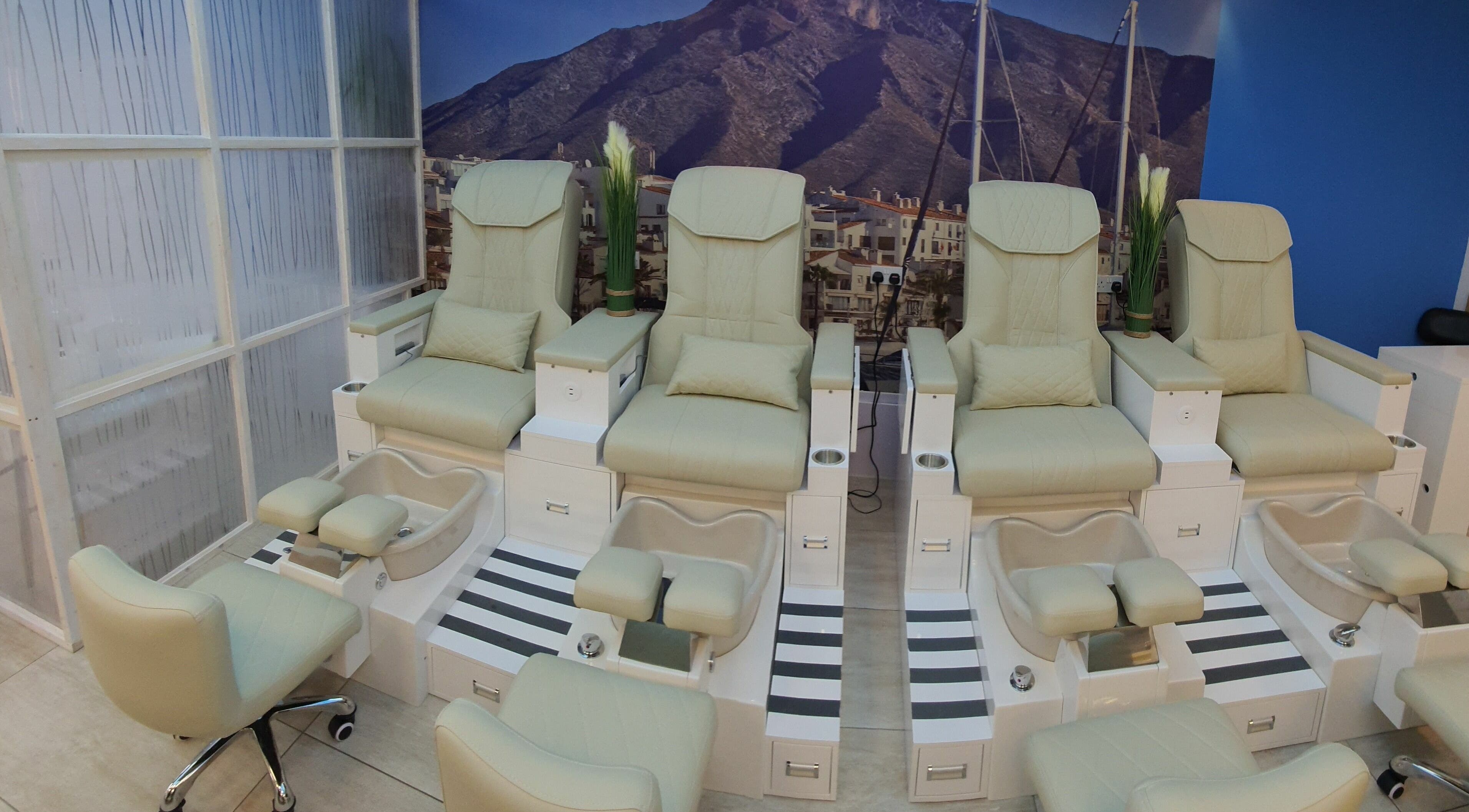 Luxurious pedicure chairs at Puerto Banus Nail Bar and Aesthetics in Cork, County Cork, IE offer a plush experience.