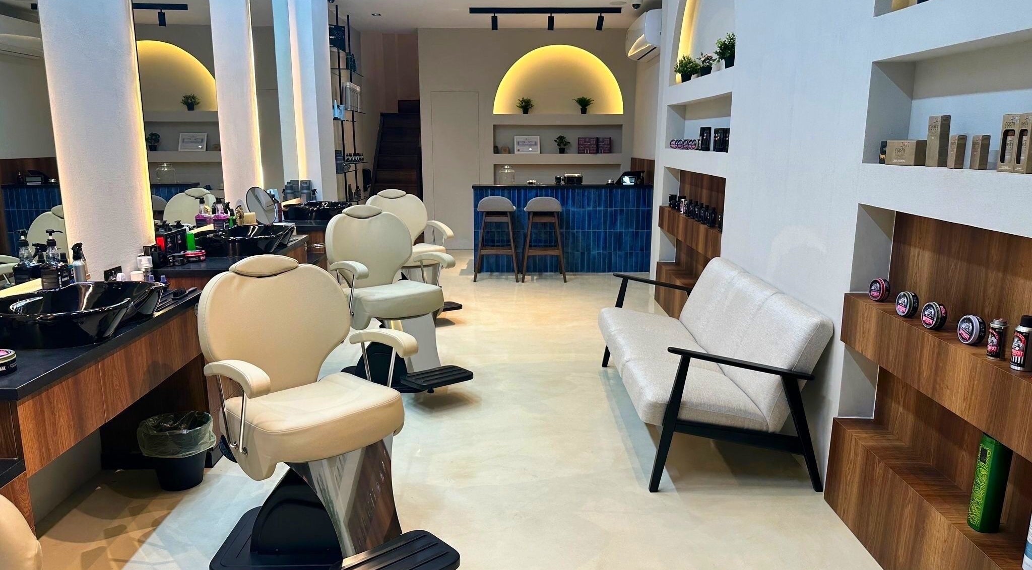 Stylish salon at Milli Trims, Saar, Al-muḥāfaẓat Aš-šamālīyah, BH with modern decor and comfortable seating.