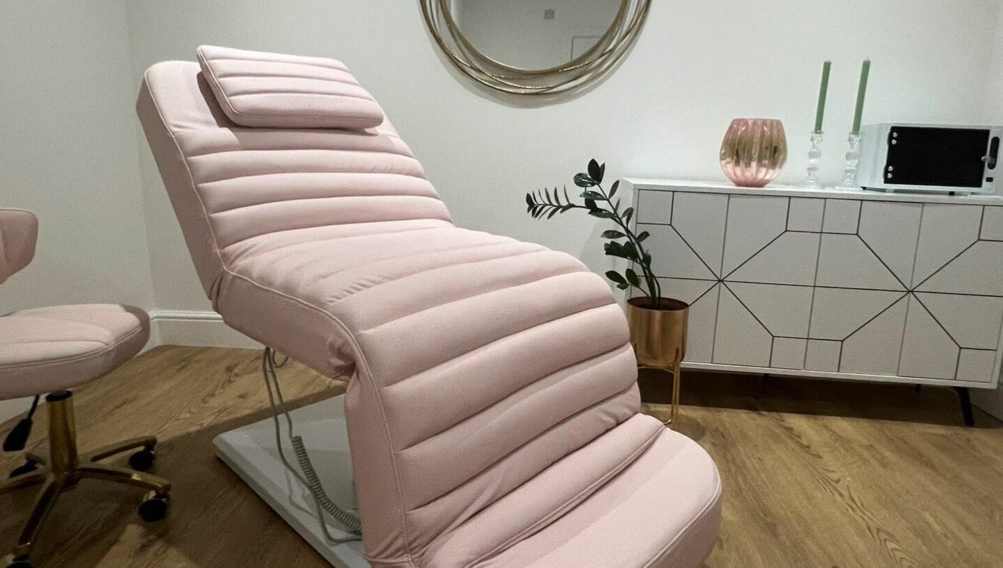 Pink padded beauty chair at You and Me - Nails by Dom, London, England, GB, set in a stylish, modern room.