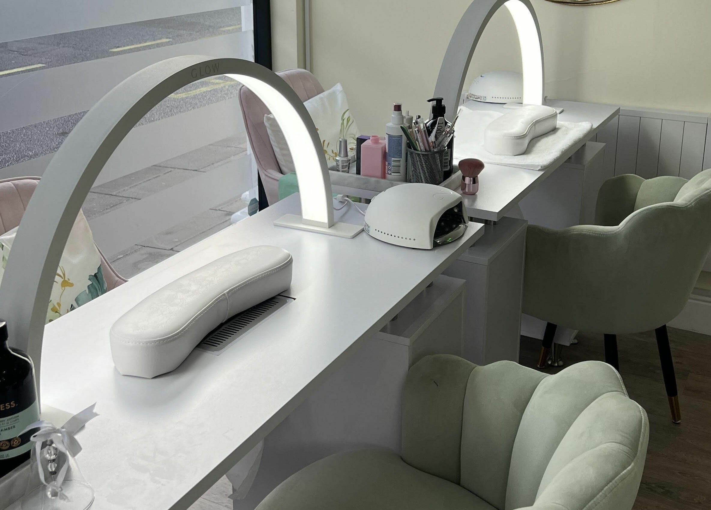 Chic nail station at You and Me - Nails by Dom, London, England, GB, featuring plush chairs and modern amenities.