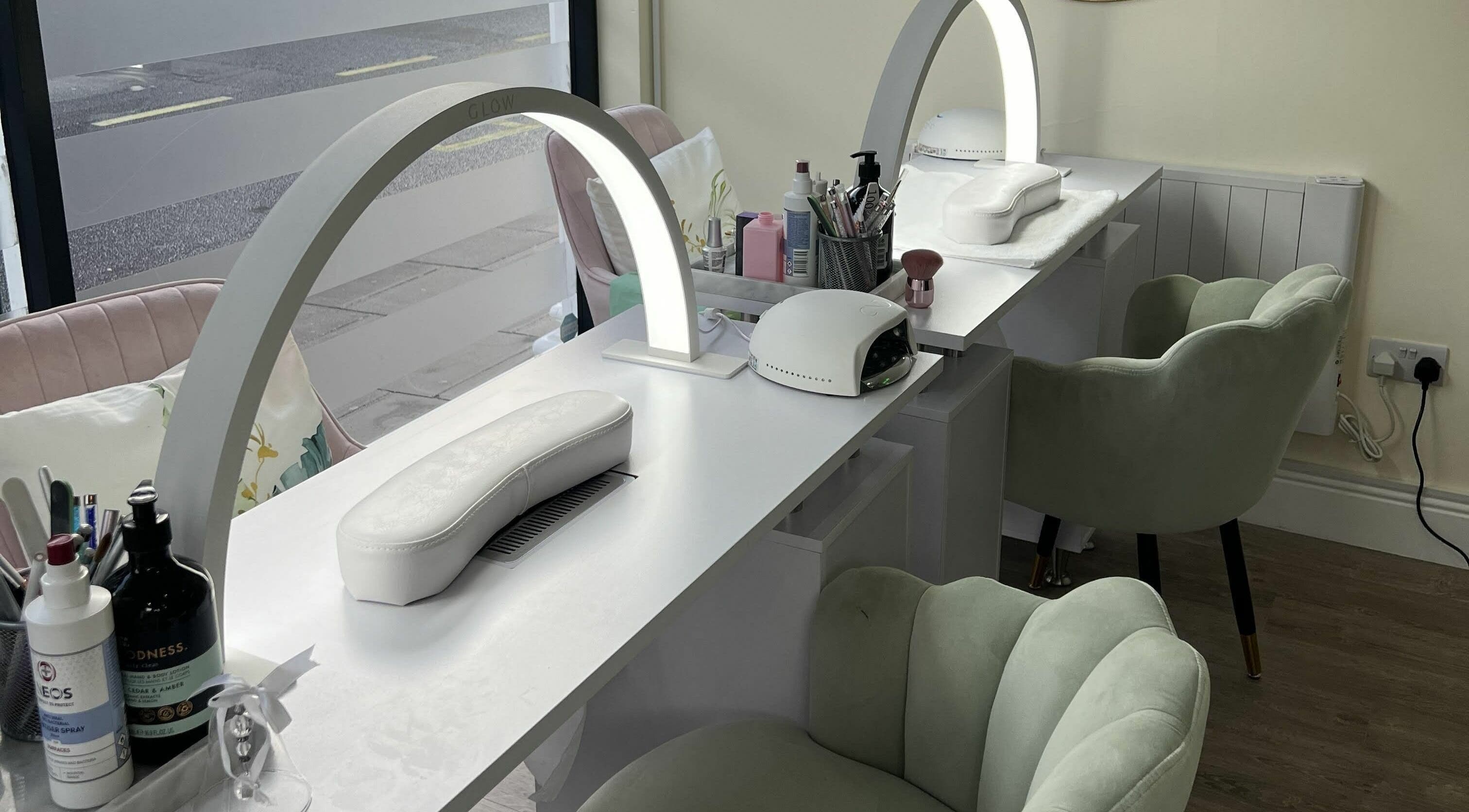 Chic nail station at You and Me - Nails by Dom, London, England, GB, featuring plush chairs and modern amenities.
