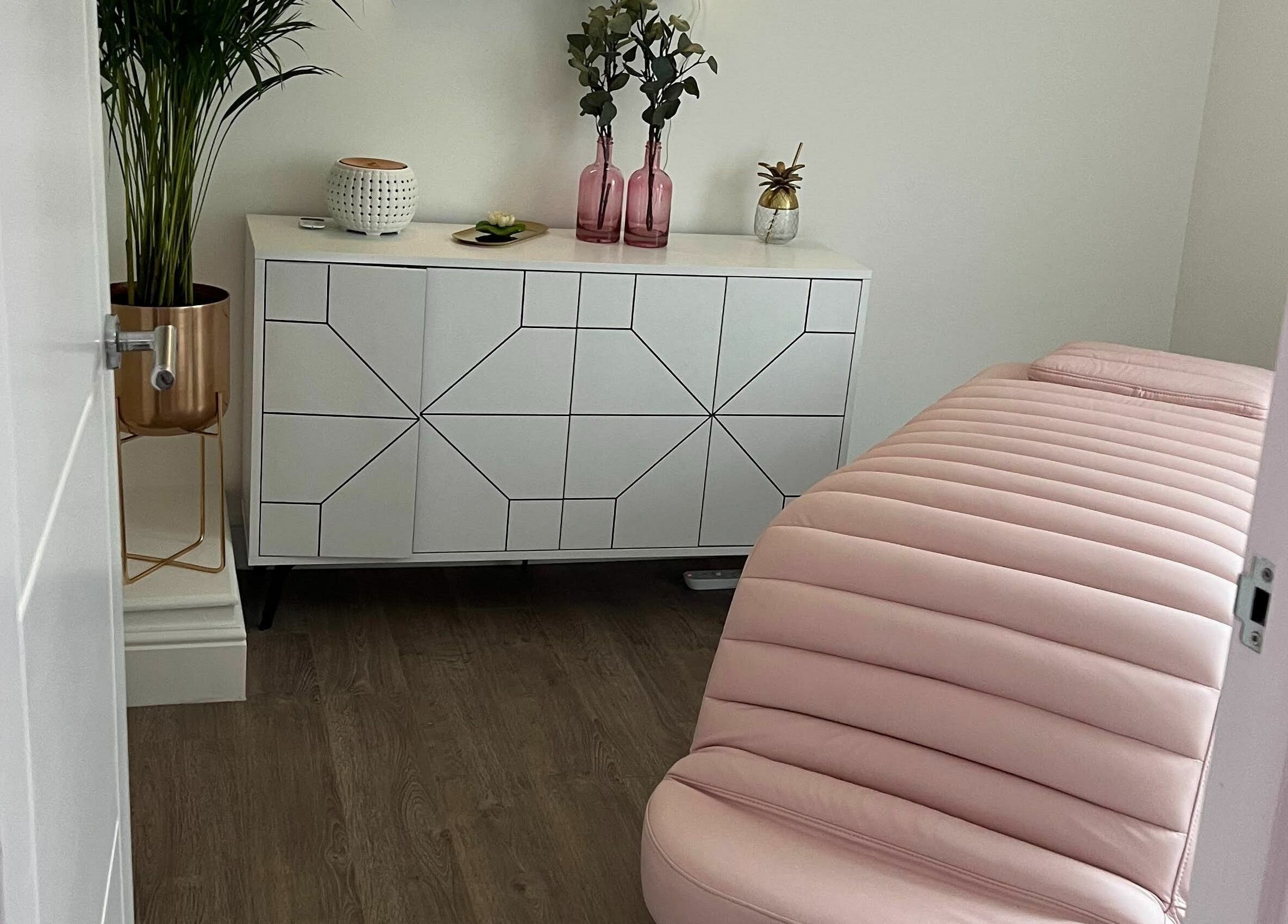 Cozy treatment room at You and Me - Nails by Dom in London, England, GB, featuring a pink bed and chic decor.