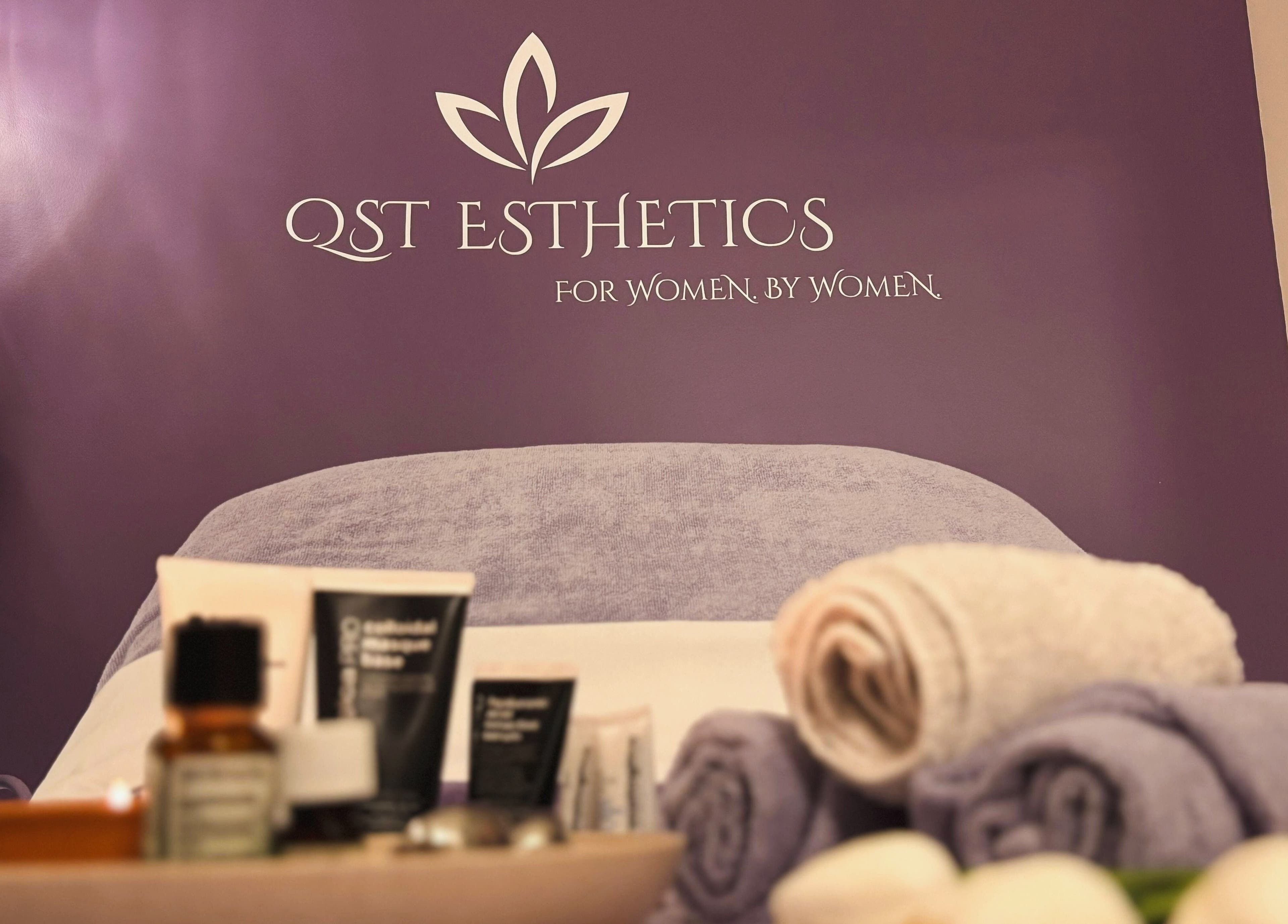 QST Esthetics - Facials and Massage in Ottawa, Ontario, CA offers a calming spa setting with lotions and towels.