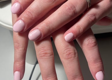 Beautifully manicured nails at HLM Nails in Charfield, England, GB showcasing soft, pastel pink finish.