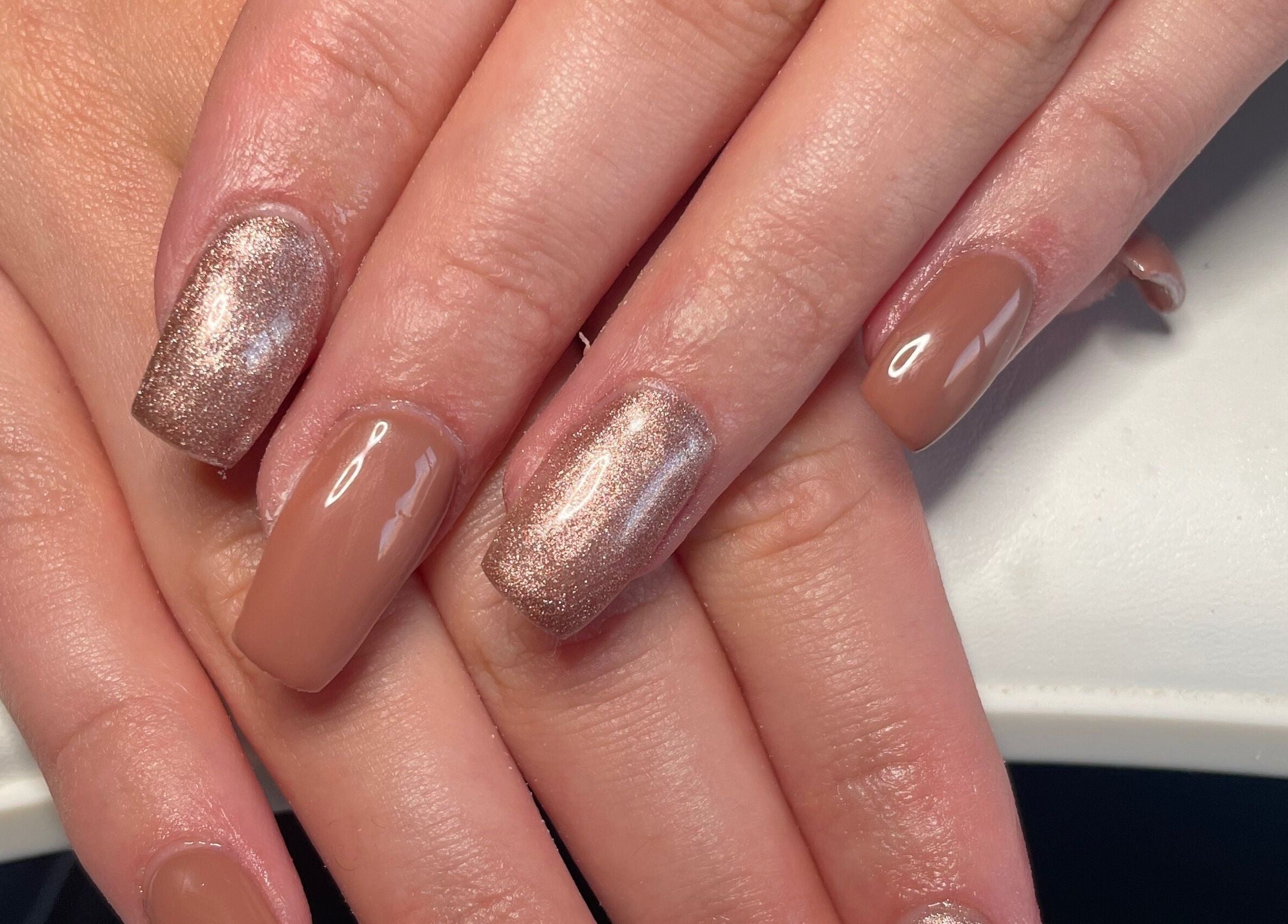 Elegant beige and glitter nails at HLM Nails, Charfield, England, GB, showcasing expert nail artistry.