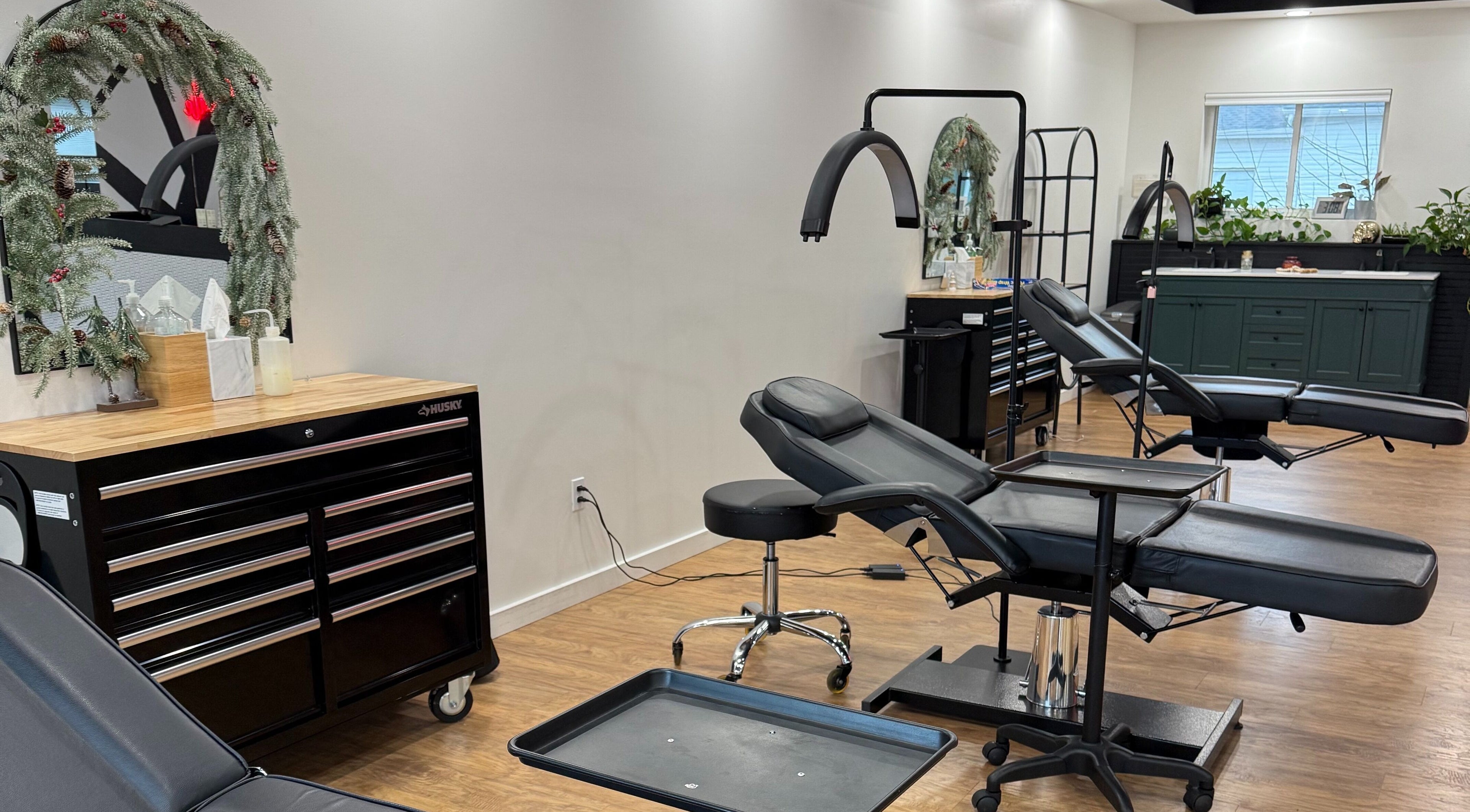The Modern Female salon interior in Westfield, Indiana, US featuring stylish treatment chairs and decor.