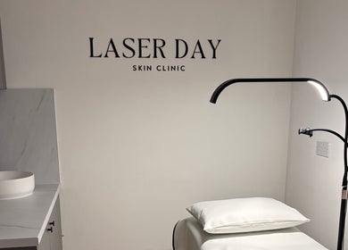 Sophisticated interior of Laser Day Skin Clinic, Liversedge, England, GB, featuring modern treatment table and lighting.