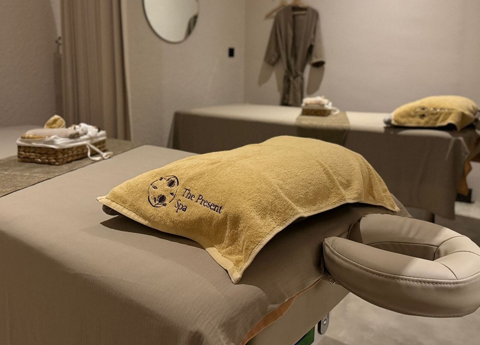 Serene massage room at The Present Spa in Bali, Bali, ID with plush towels and soothing decor.