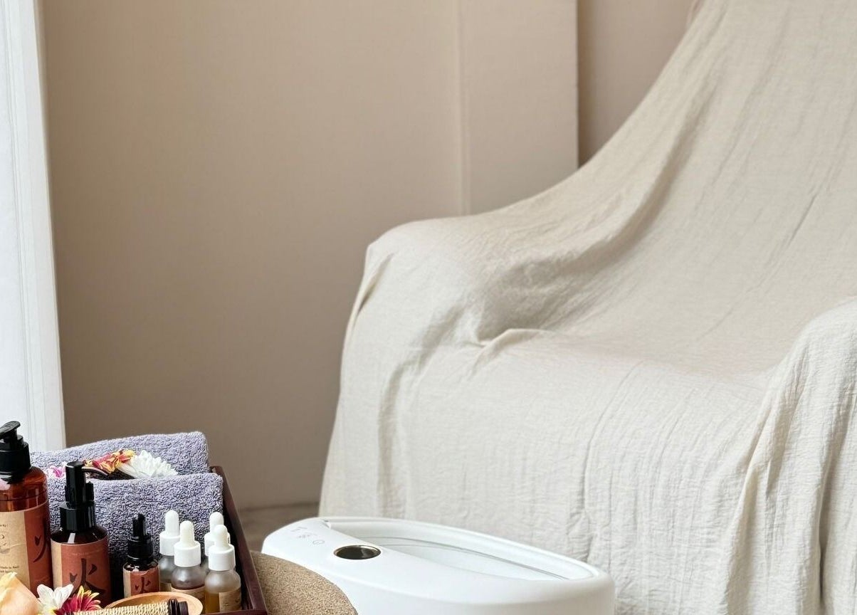 Relaxing spa chair and essential oils at The Present Spa, Bali, Bali, ID, creating a tranquil experience.