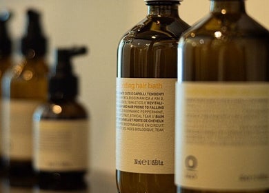 Hair spa products at Kenko Japanese Hair Spa, Dubai, Dubai, AE. Elegant bottles lined up for premium hair care.