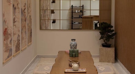Peaceful room at Kenko Spa, Dubai, AE, featuring elegant decor, artwork, and tranquil ambiance.