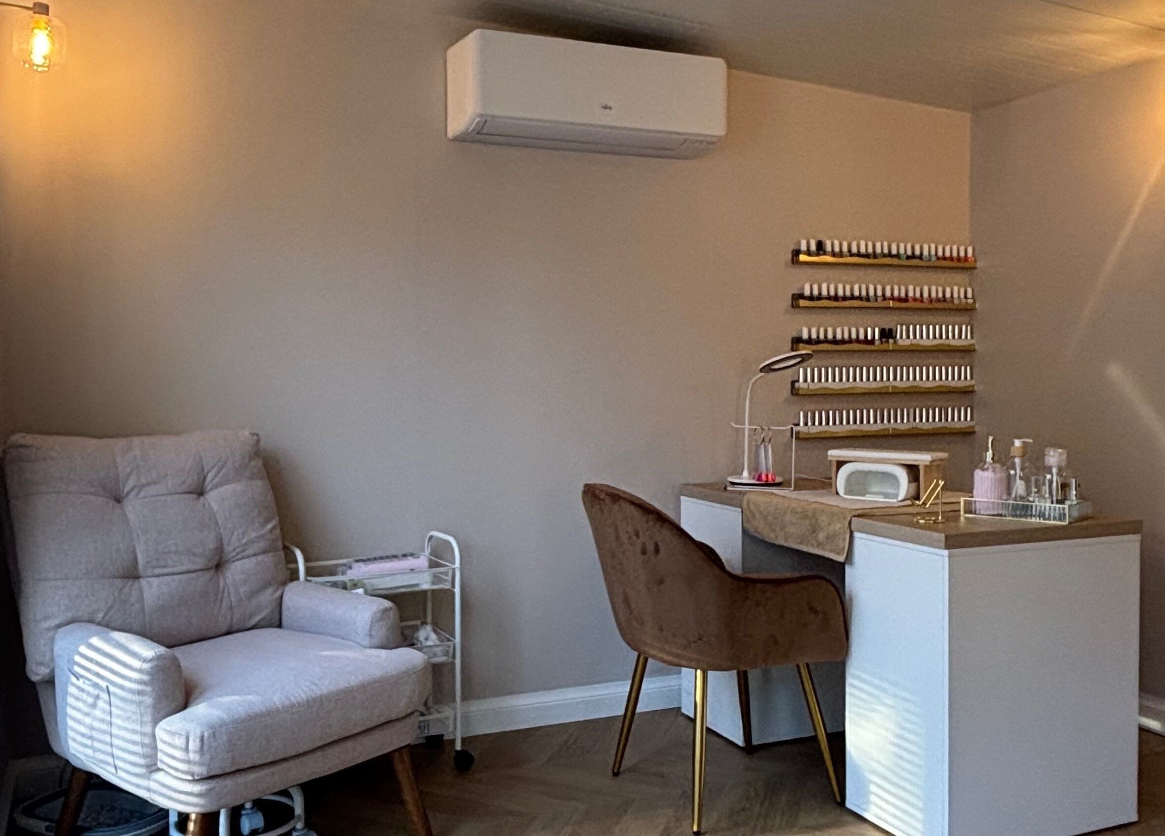 Tranquil beauty corner at Glow Beauty by Lorna, Cleethorpes, England, GB with cozy chair and nail station.