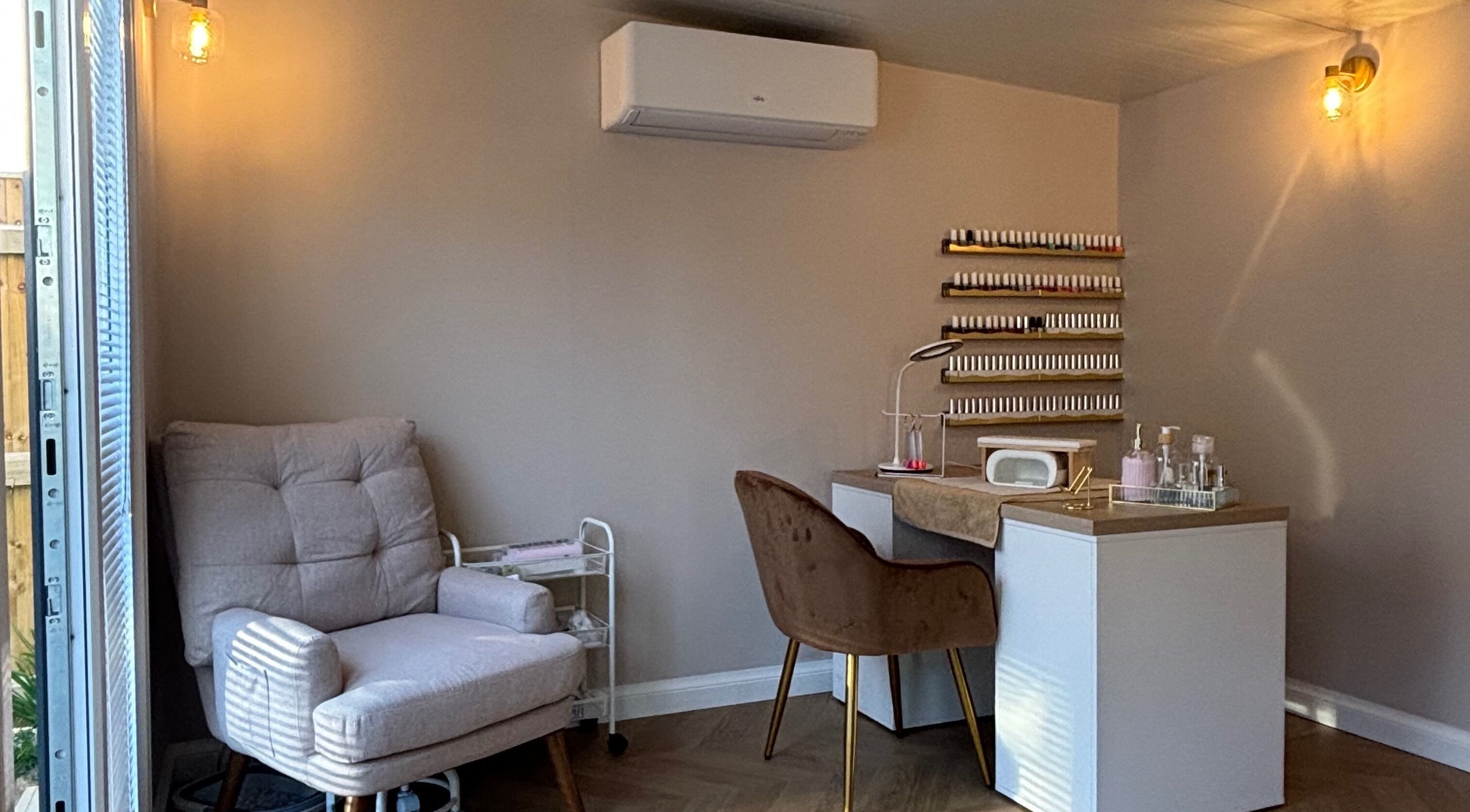 Tranquil beauty corner at Glow Beauty by Lorna, Cleethorpes, England, GB with cozy chair and nail station.