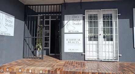Front entrance of Habitual Beauty, Cape Town, Western Cape, ZA, featuring elegant signage.