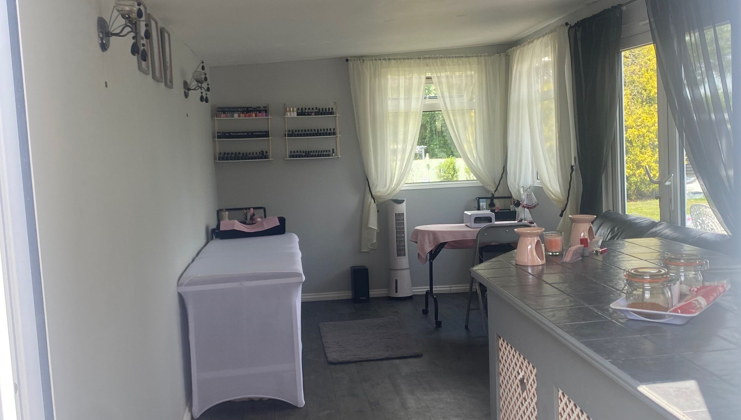 Relaxing spa interior at Beauty_by_marni, Fen Street, England, GB, featuring a cozy treatment table and soothing decor.