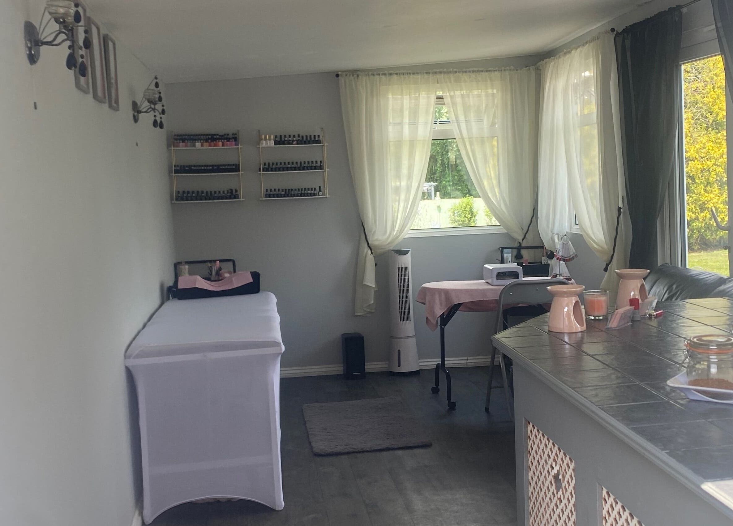 Relaxing spa interior at Beauty_by_marni, Fen Street, England, GB, featuring a cozy treatment table and soothing decor.