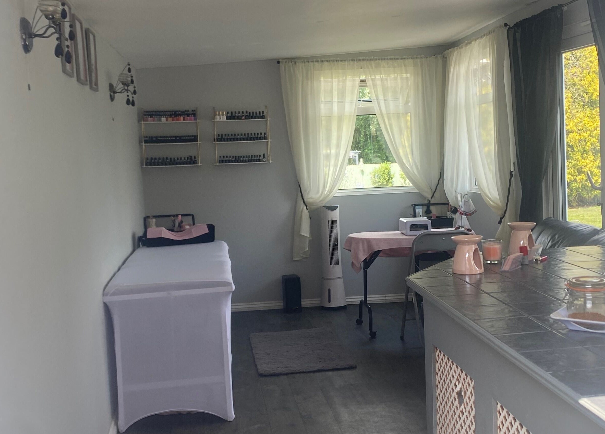 Relaxing spa interior at Beauty_by_marni, Fen Street, England, GB, featuring a cozy treatment table and soothing decor.