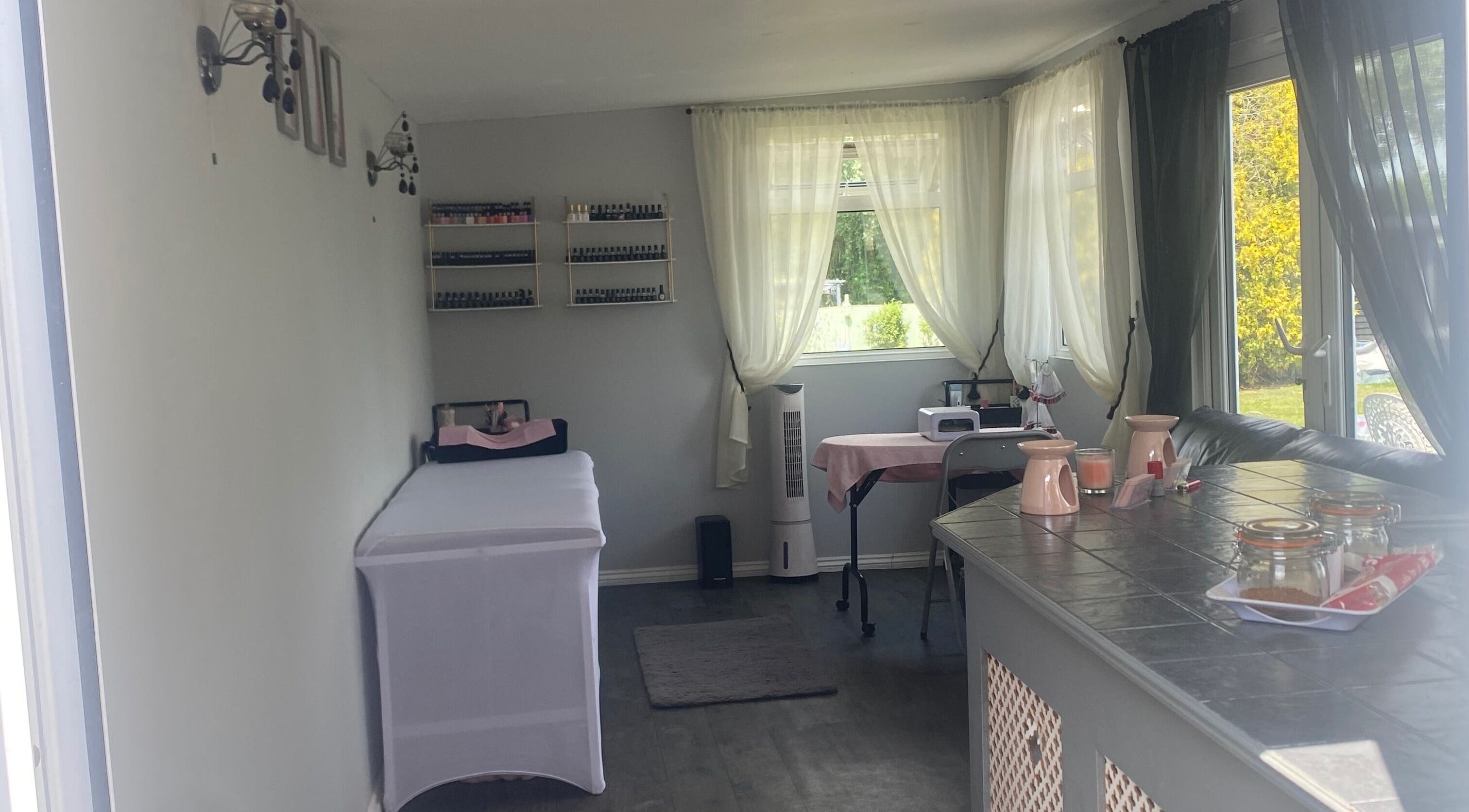 Relaxing spa interior at Beauty_by_marni, Fen Street, England, GB, featuring a cozy treatment table and soothing decor.