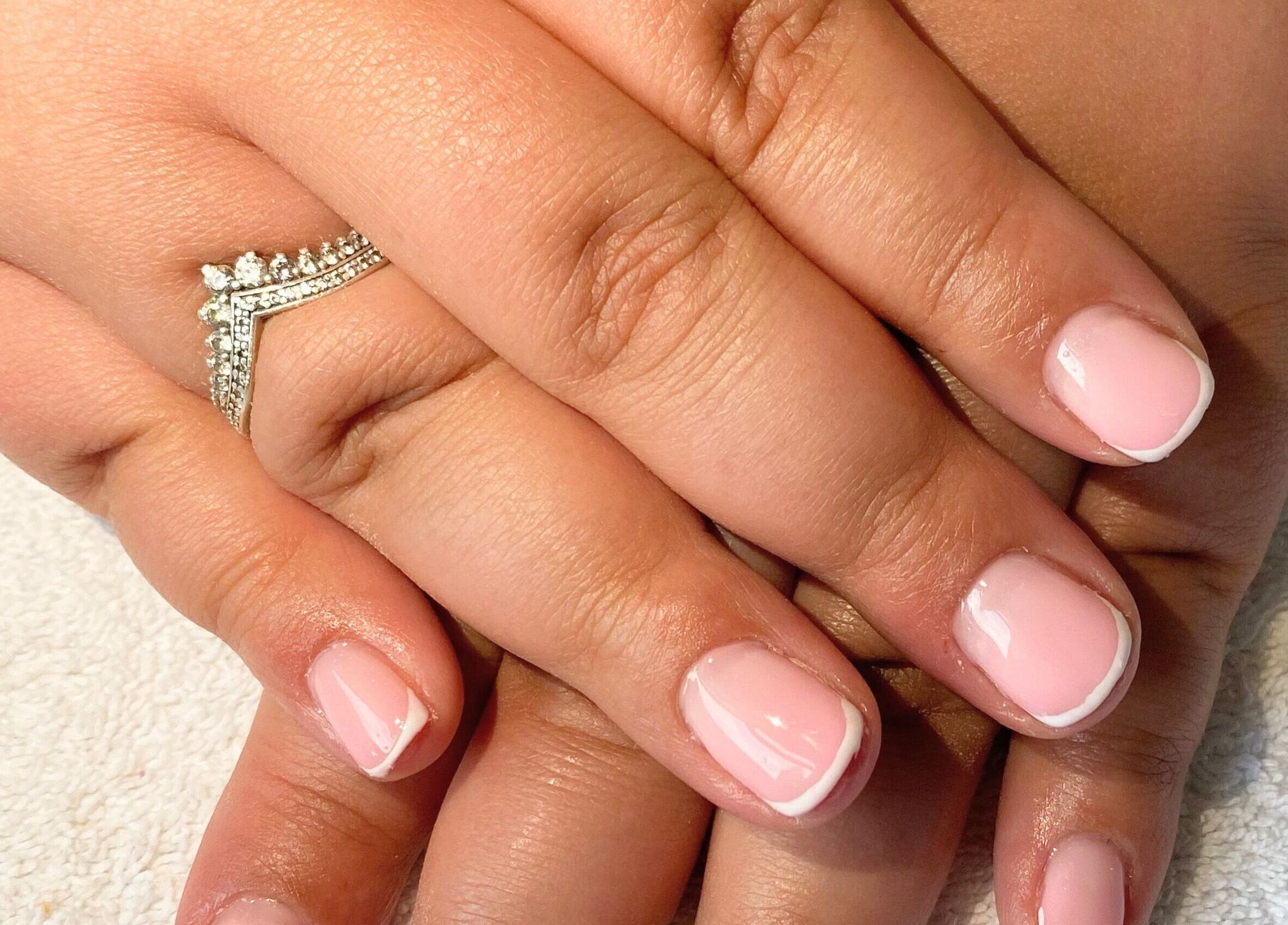 Classic French manicure at Beauty_by_marni on Fen Street, England, GB, showcasing polished elegance.