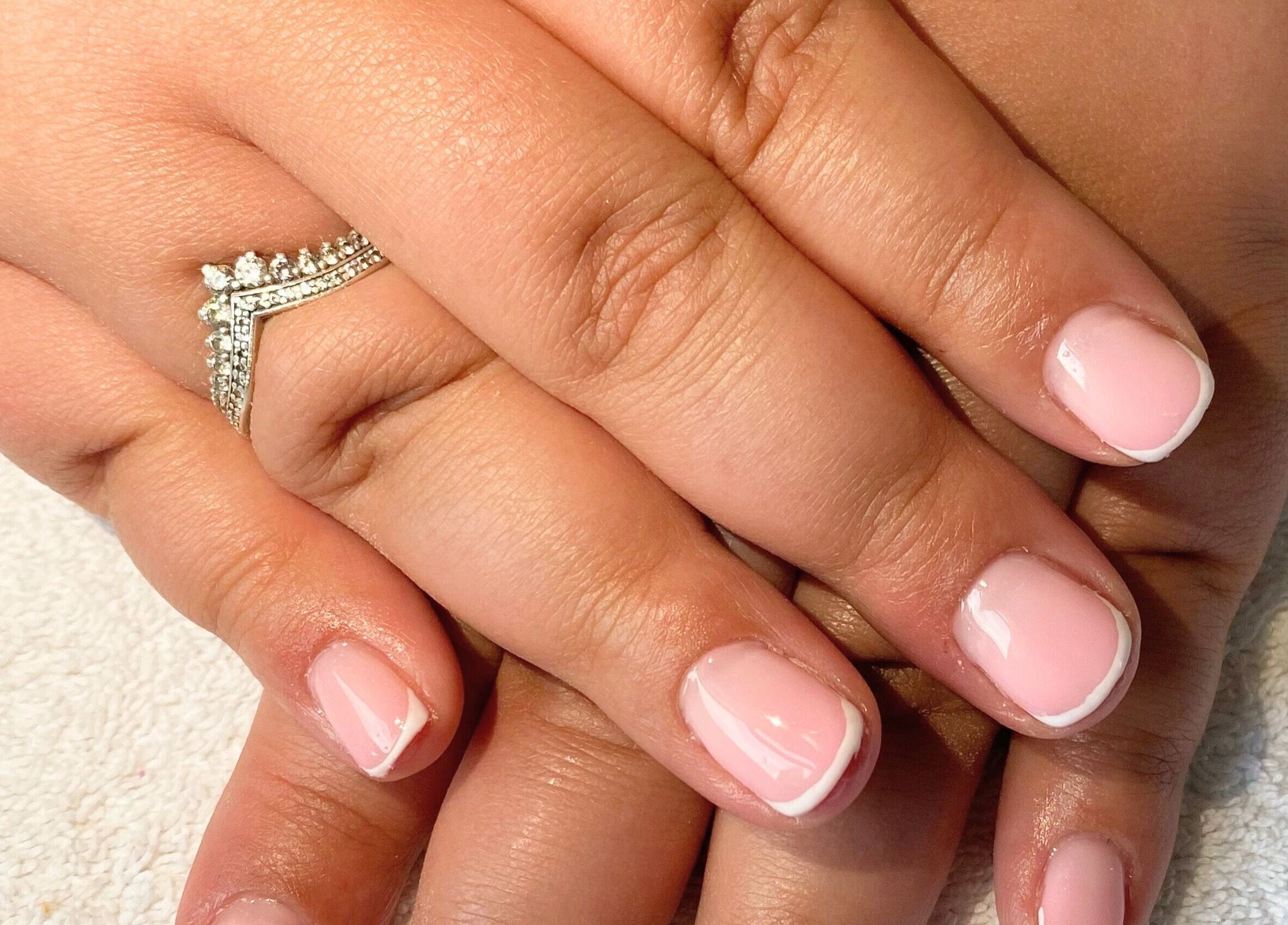 Classic French manicure at Beauty_by_marni on Fen Street, England, GB, showcasing polished elegance.