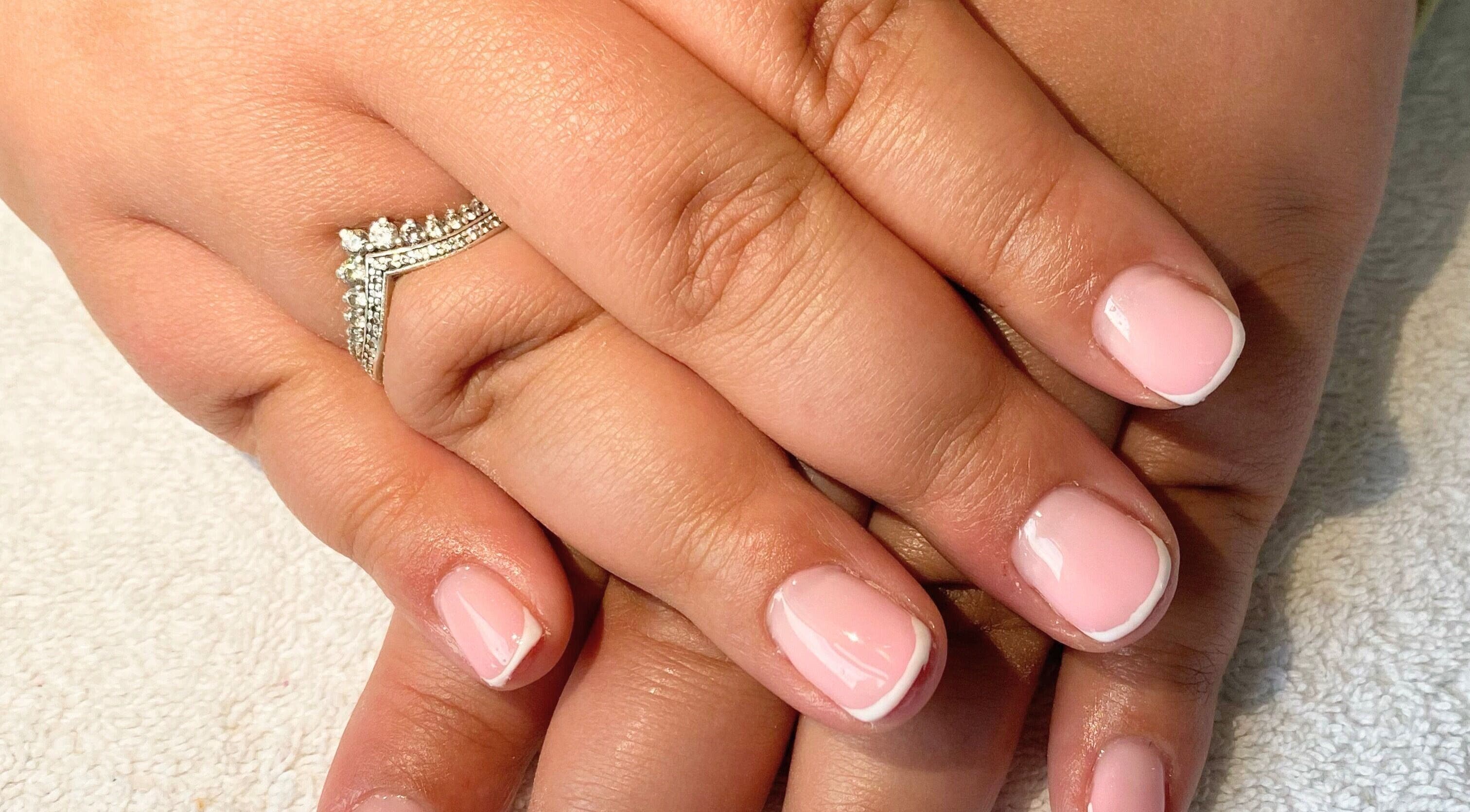 Classic French manicure at Beauty_by_marni on Fen Street, England, GB, showcasing polished elegance.