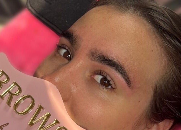 Eyebrow enhancement at Brows By Bailey, Bristol, England, GB with a pink branding card.