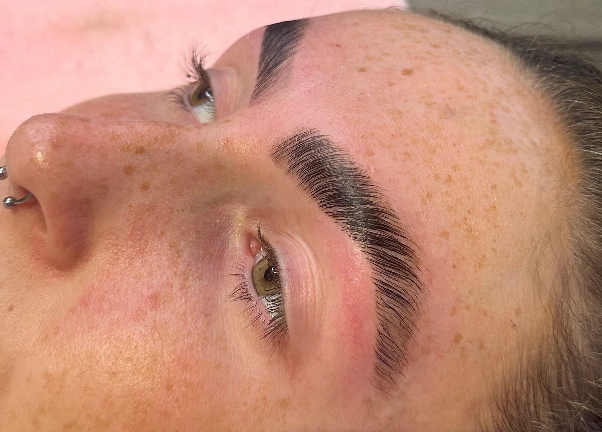 Close-up of perfectly groomed eyebrows at Brows By Bailey, Bristol, England, GB.