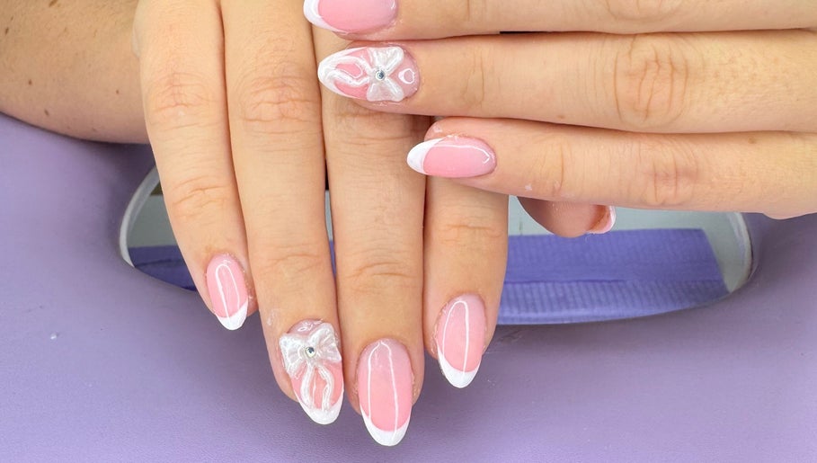 Beautiful pink and white nail art with bow design at The Witchery, Glasgow, Scotland, GB.