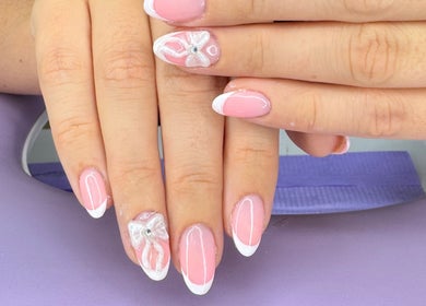 Beautiful pink and white nail art with bow design at The Witchery, Glasgow, Scotland, GB.