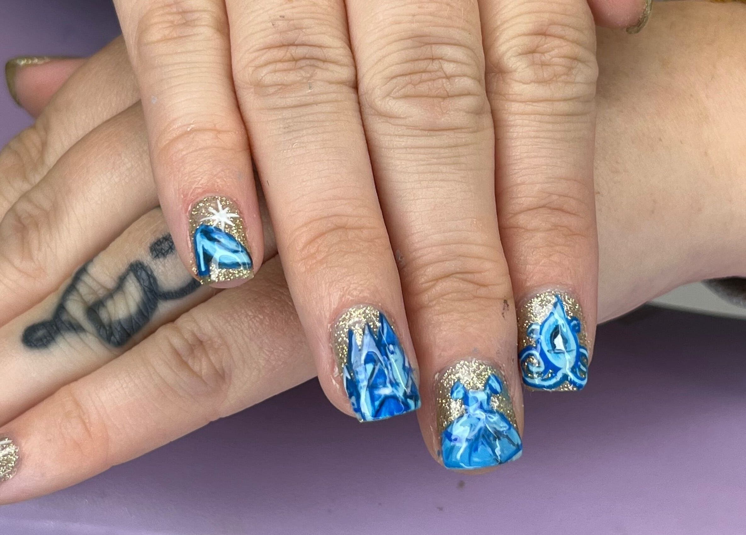 Blue and gold nail art at The Witchery, Glasgow, Scotland, GB showcases intricate design and elegance.