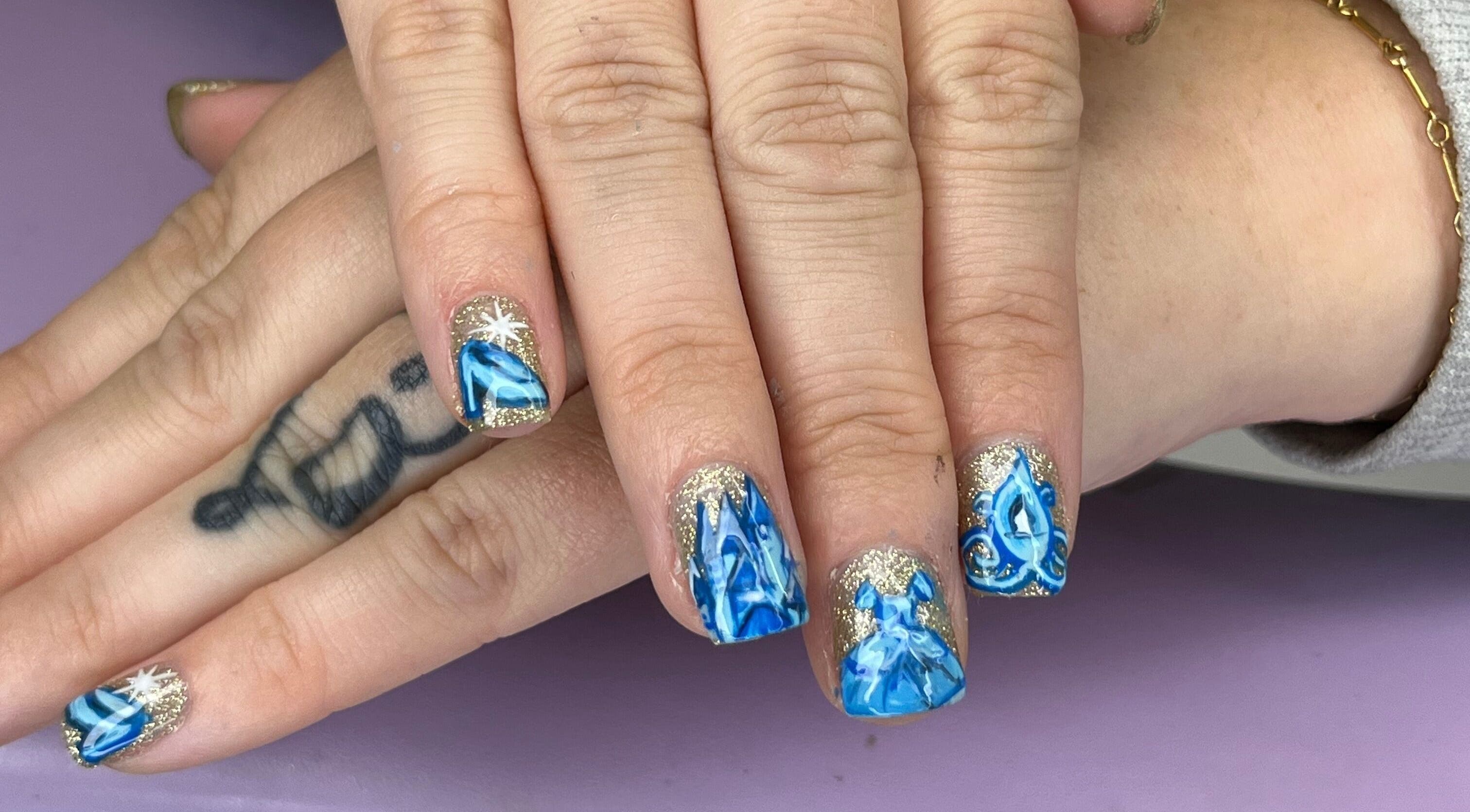 Blue and gold nail art at The Witchery, Glasgow, Scotland, GB showcases intricate design and elegance.