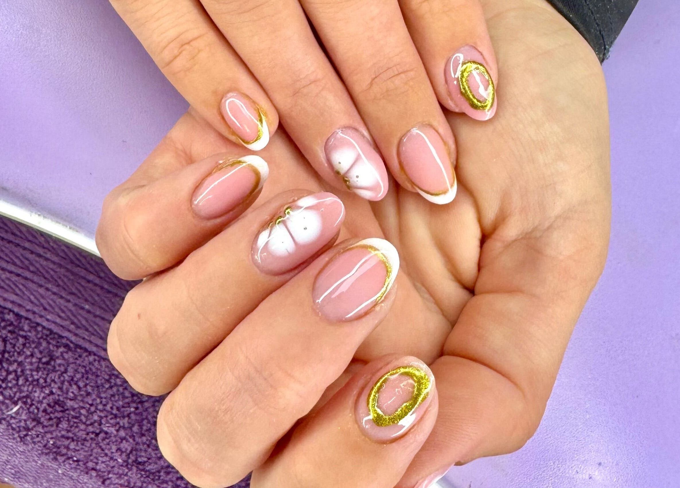 Elegant nail art at The Witchery, Glasgow, Scotland, GB, featuring pink and gold designs.