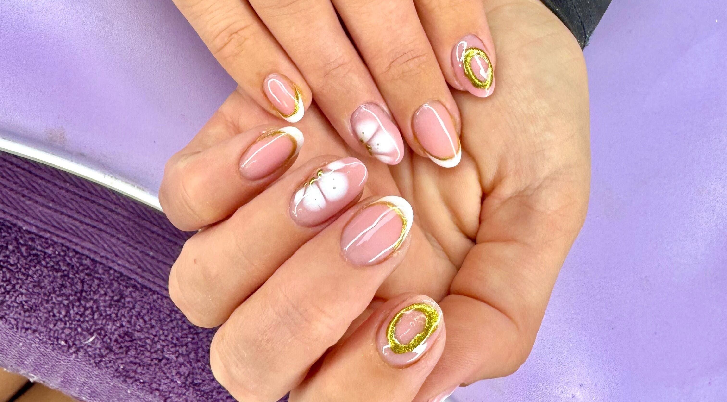 Elegant nail art at The Witchery, Glasgow, Scotland, GB, featuring pink and gold designs.