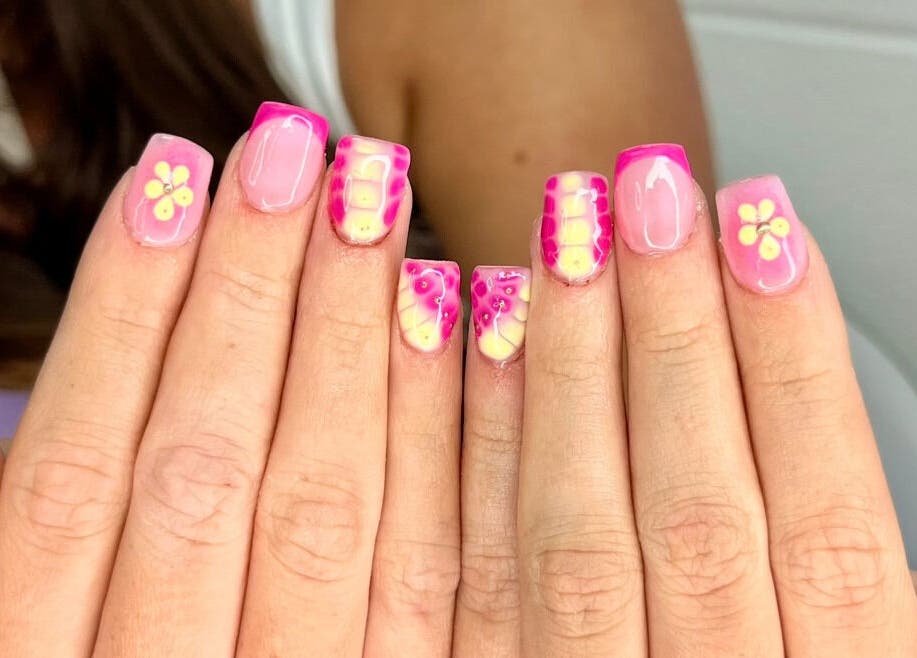 Bright pink floral nail art at The Witchery, Glasgow, Scotland, GB highlighting creative nail designs.