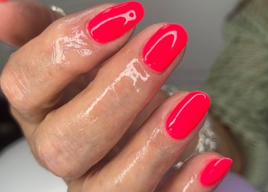 Bright glossy nails at The Witchery in Glasgow, Scotland, GB, showcasing expert manicure services.