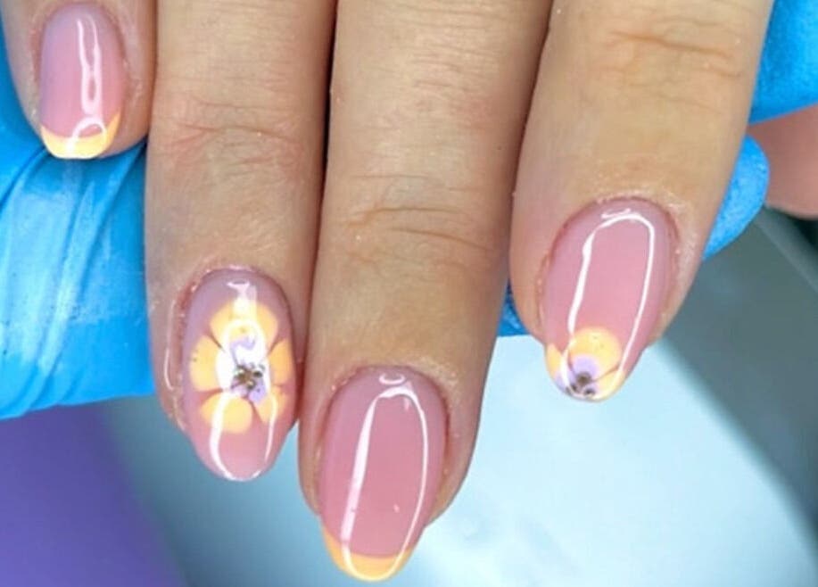 Elegant floral nail art at The Witchery, Glasgow, Scotland, GB. Features delicate flower designs and glossy finish.