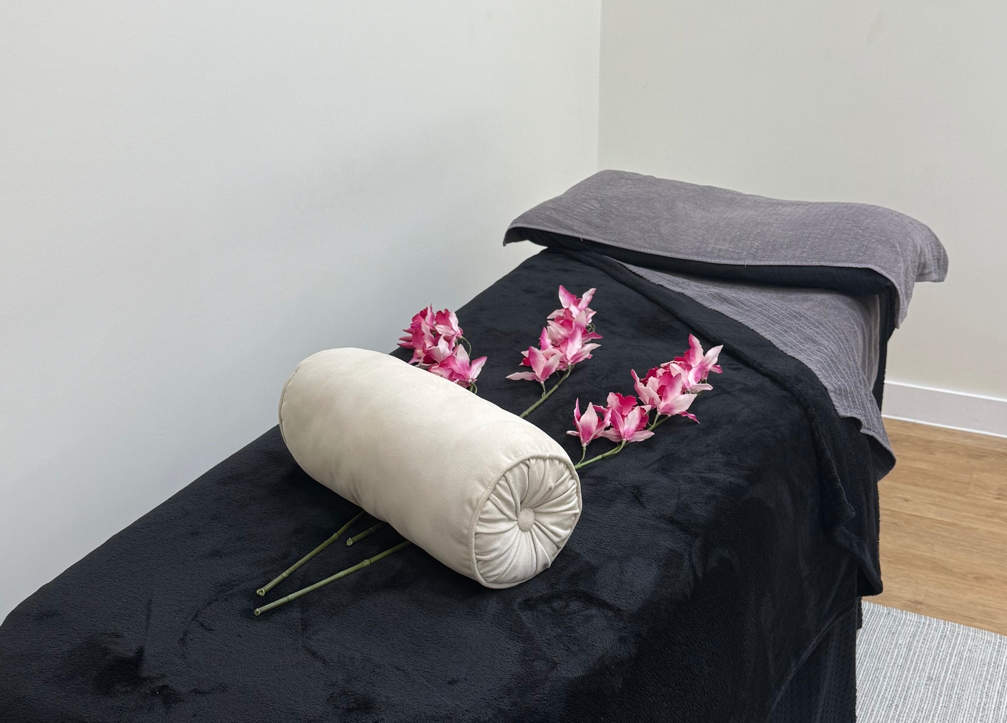 Luxurious massage table with orchids at SKR Beauty Bar, Broadbridge Heath, England, GB.