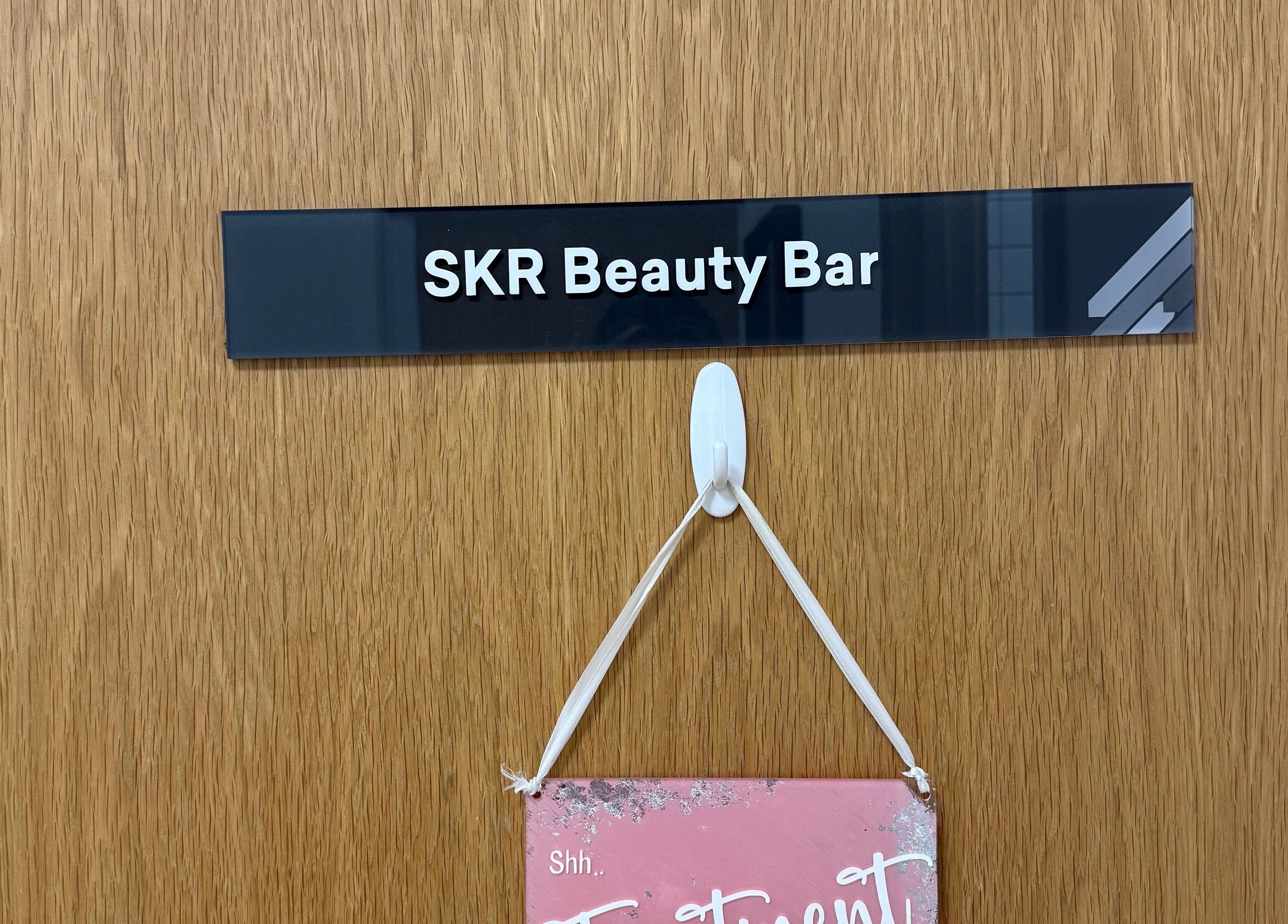 SKR Beauty Bar entrance sign at Broadbridge Heath, England, GB, enhancing the venue's welcoming appeal.