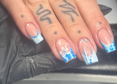 Elegant blue floral nail art at Lvy Luxe Nails, Swindon, England, GB showcasing delicate design expertise.