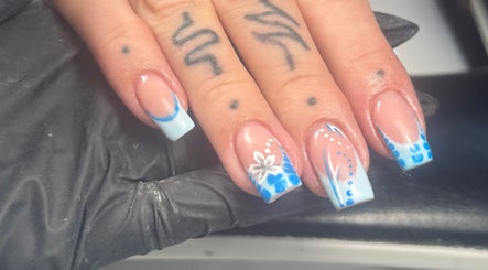 Elegant blue floral nail art at Lvy Luxe Nails, Swindon, England, GB showcasing delicate design expertise.
